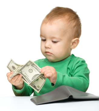Cute little boy is counting money